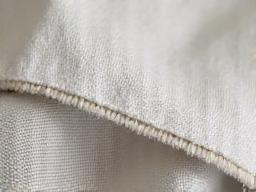 Detalle tejido costura calidad premium